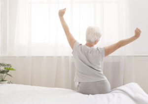 Elderly woman stretching for joint pain