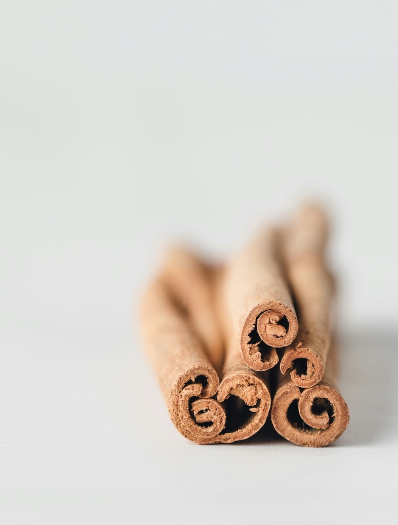 Rolls of raw cinnamon on a table