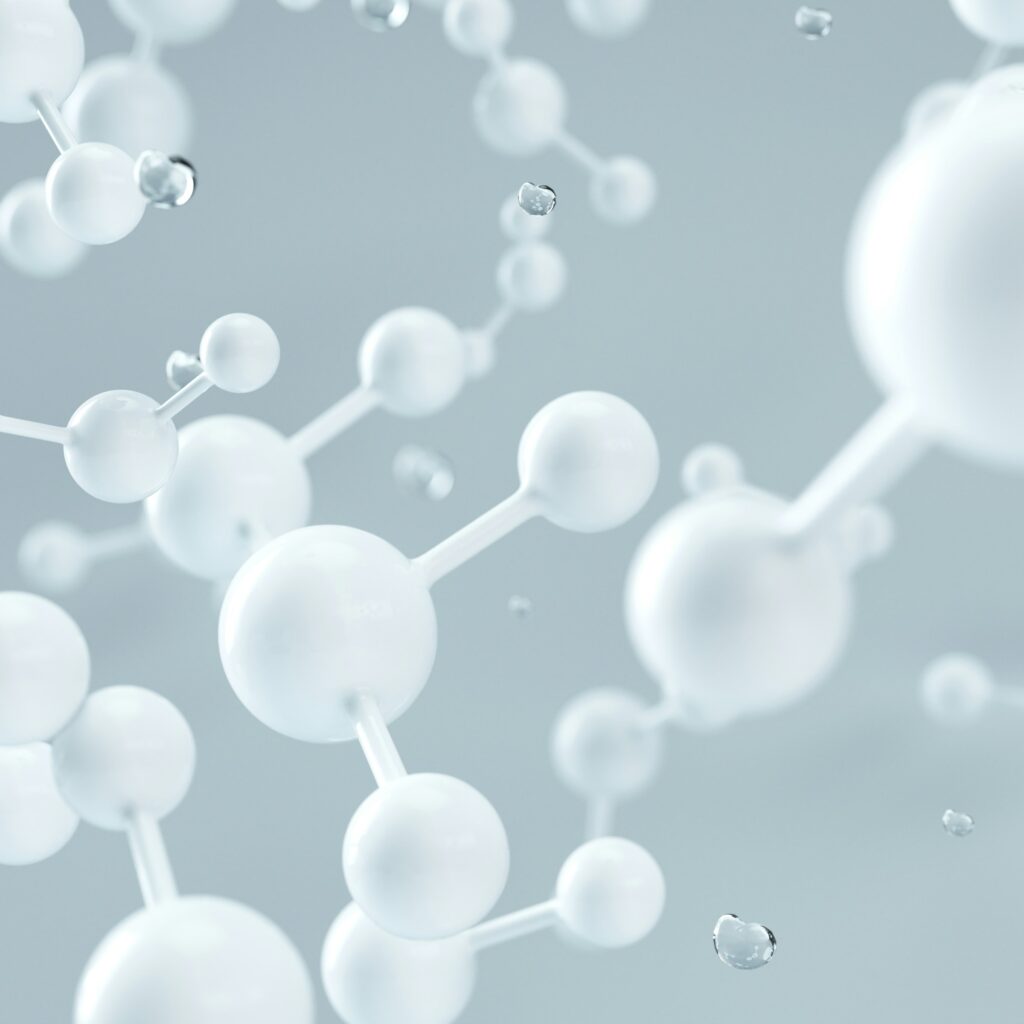 Molecules swimming around on a grey background