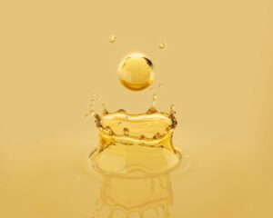 A drop of beautiful oil bouncing into liquid