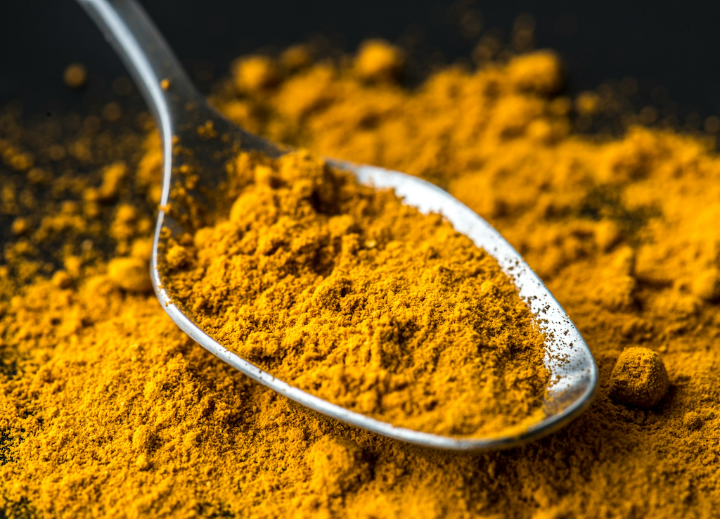 Turmeric powder in spoon